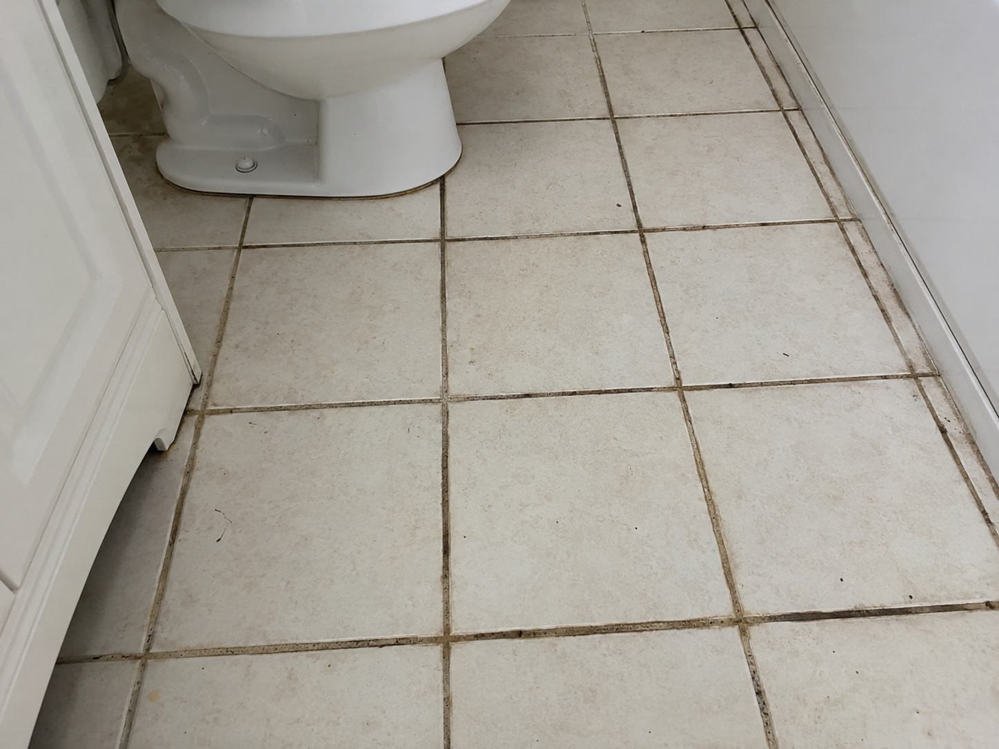 Worn, dirty tile grout before professional grout cleaning by Grout Essentials in Greenville SC